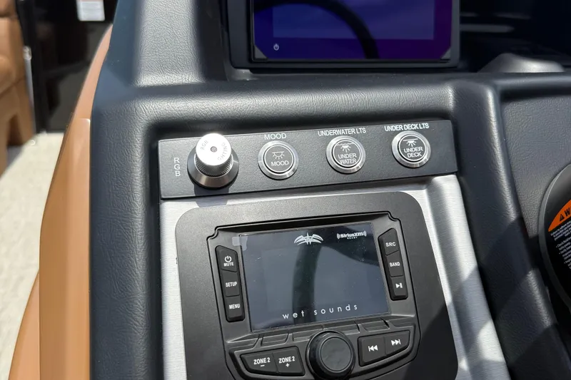 Slide: The Image of Control panel of 2026 Berkshire 23RFX STS with audio system and lighting controls. - 13