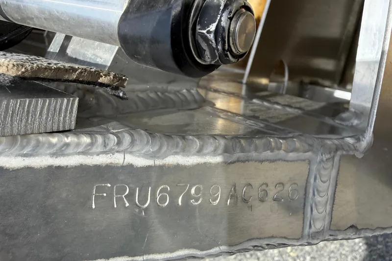 Slide: The Image of Close-up of a 2026 Berkshire 23RFX STS boat hull with serial number FRU6799AC626. - 19