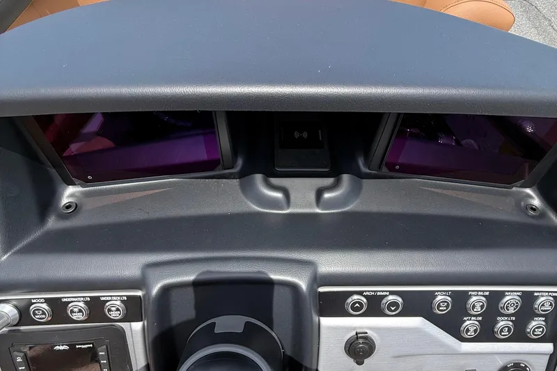 Slide: The Image of Dashboard of 2026 Berkshire 23RFX STS boat with control panel and screens. - 12