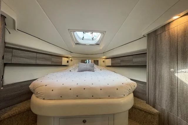 Slide: The Image of Luxurious bedroom interior of 2007 Sea Ray 44 Sedan Bridge yacht with skylight and modern design. - 25