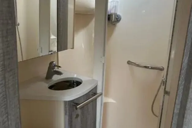 Slide: The Image of Bathroom interior of 2007 Sea Ray 44 Sedan Bridge yacht, featuring sink and shower. - 24