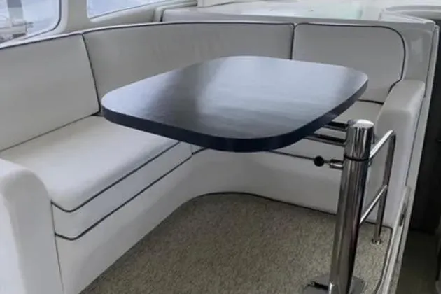 Slide: The Image of Luxurious interior seating area of a 2007 Sea Ray 44 Sedan Bridge yacht. - 14
