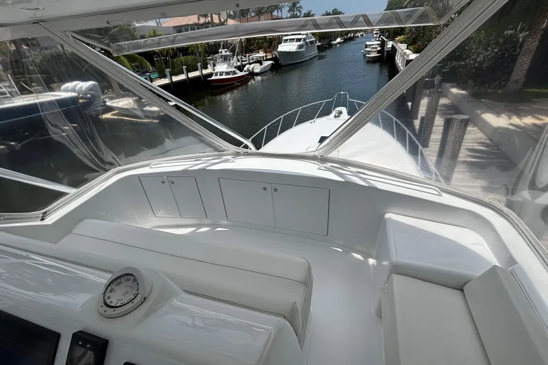 Slide: The Image of 2005 Hatteras 50 Convertible yacht interior with canal view and luxurious seating. - 11