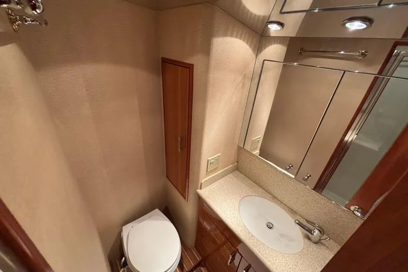 Slide: The Image of Luxurious bathroom in 2005 Hatteras 50 Convertible yacht with modern fixtures. - 23