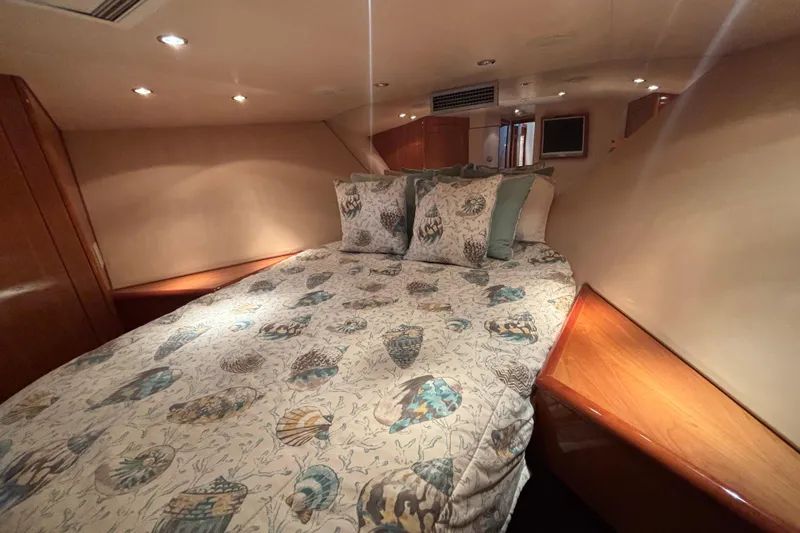 Slide: The Image of Luxurious cabin interior of 2005 Hatteras 50 Convertible yacht with elegant bedding. - 16