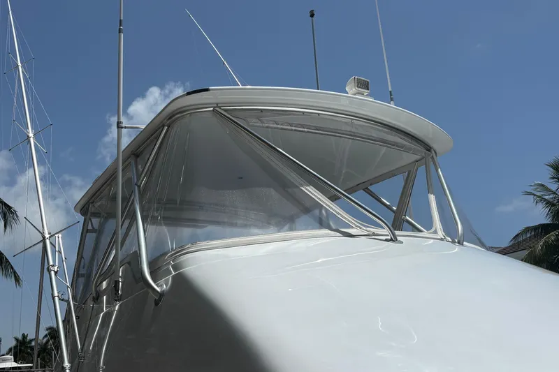 Slide: The Image of 2005 Hatteras 50 Convertible yacht against a clear blue sky. - 3
