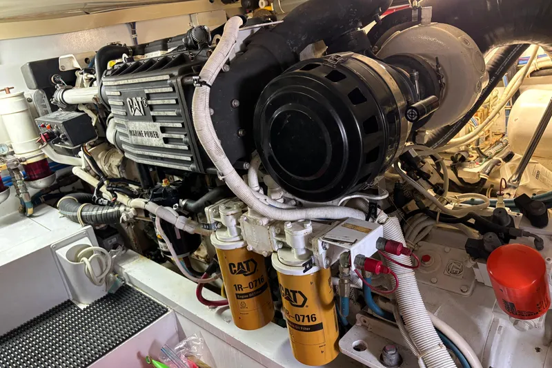 Slide: The Image of Engine room of a 2005 Hatteras 50 Convertible with CAT marine power components. - 28