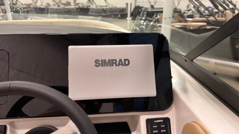 Slide: The Image of The image shows a Simrad display on a Sea Ray SDX 230 boat. - 29