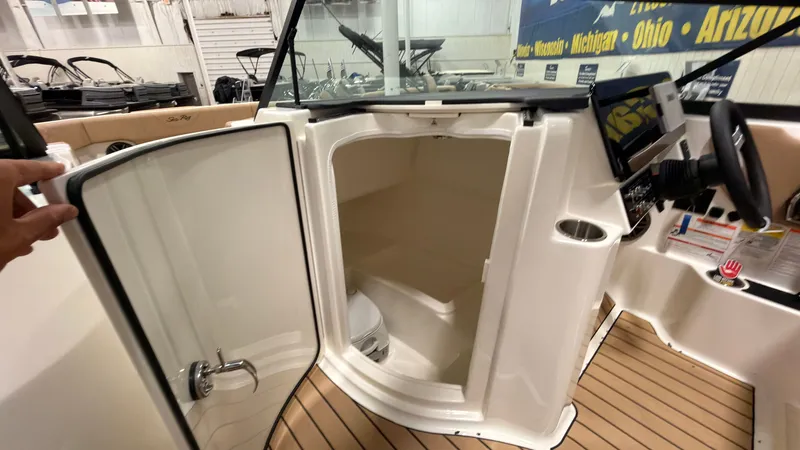 Slide: The Image of The image shows the interior of a 2026 Sea Ray SDX 230 boat with a cabin. - 44