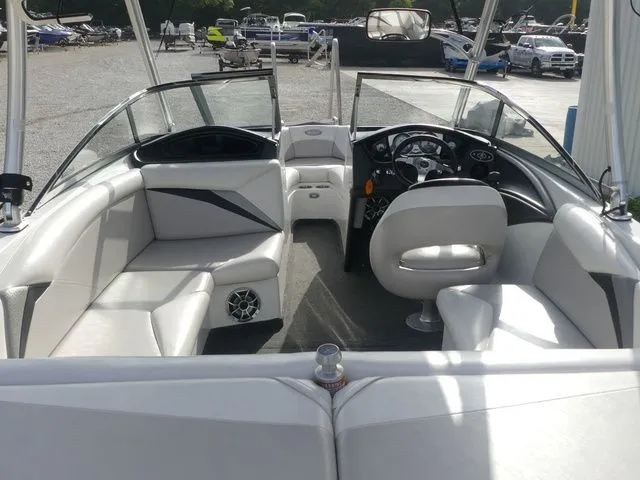 Slide: The Image of Interior view of a 2008 Tigé Z1 boat with white seating and a modern helm. - 16