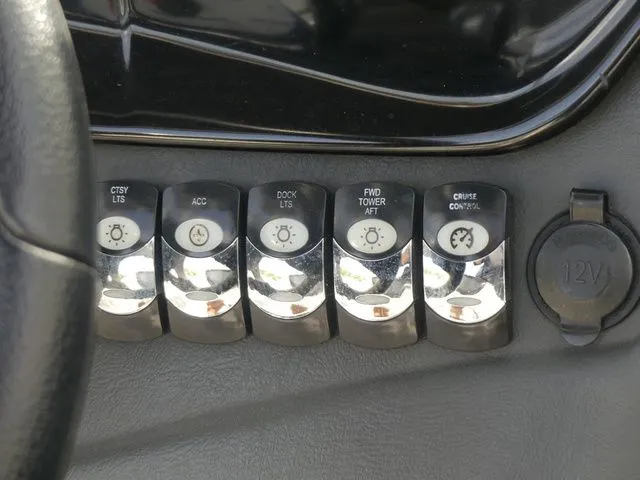 Slide: The Image of Close-up of switches and a 12V outlet on a boat. - 28