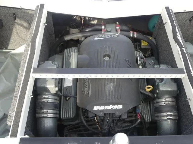 Slide: The Image of The engine compartment of a 2008 Tigé Z1 boat with a MarinePower engine. - 24