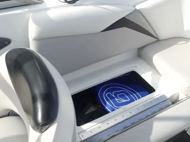 Slide: The Image of The image shows a boat interior with white upholstery and a storage compartment. - 21