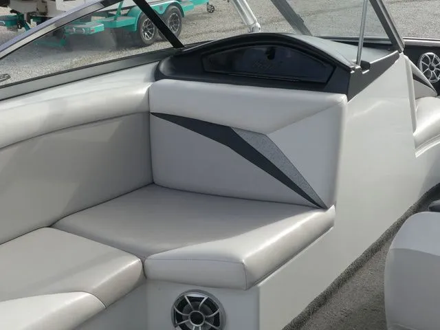 Slide: The Image of Interior of a 2008 Tigé Z1 with gray upholstery and speakers. - 18