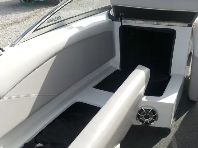 Slide: The Image of Interior of a 2008 Tigé Z1 with gray upholstery and speaker. - 20