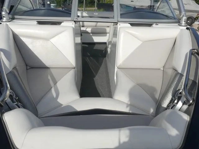 Slide: The Image of Interior view of a 2008 Tigé Z1 with white leather seats. - 13