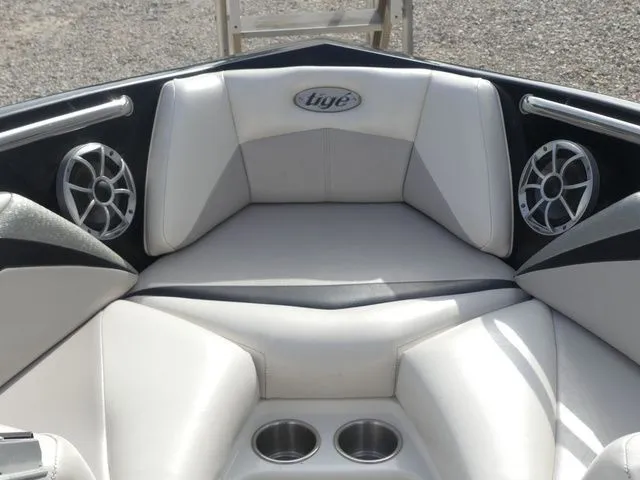 Slide: The Image of The image shows the bow area of a 2008 Tigé Z1 boat with white upholstery and speakers. - 19