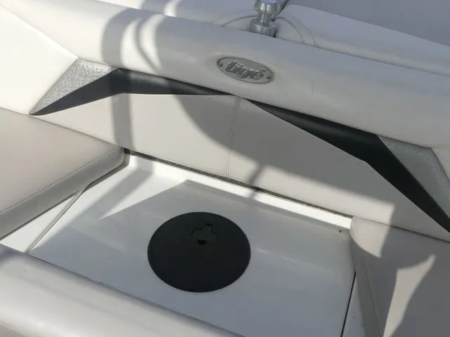 Slide: The Image of Close-up of a white seating area with Tigé logo on a 2008 Tigé Z1 boat. - 22