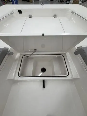Slide: The Image of The image shows the interior of a Bay Rider 2260 FS boat with an open storage compartment. - 5