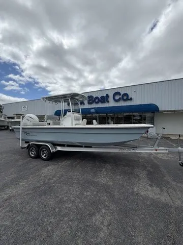 The Image of A Bay Rider 2260 FS boat on a trailer in front of a building labeled "Boat Co." - 1