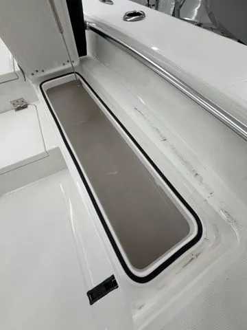 Slide: The Image of An open storage compartment on a 2026 Bay Rider 2260 FS boat. - 6