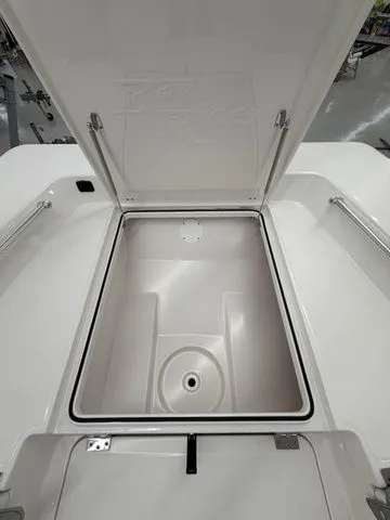 Slide: The Image of Open storage compartment on a Bay Rider 2260 FS boat, featuring smooth white surfaces. - 4