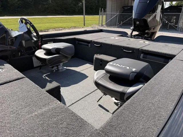 Slide: The Image of Interior view of a Lund 1875 Pro-V Bass XS boat with two cushioned seats. - 11