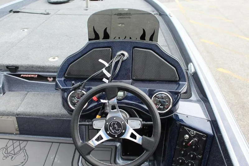 Slide: The Image of Steering console of 2027 Phoenix 921 Elite X boat with modern dashboard design. - 20