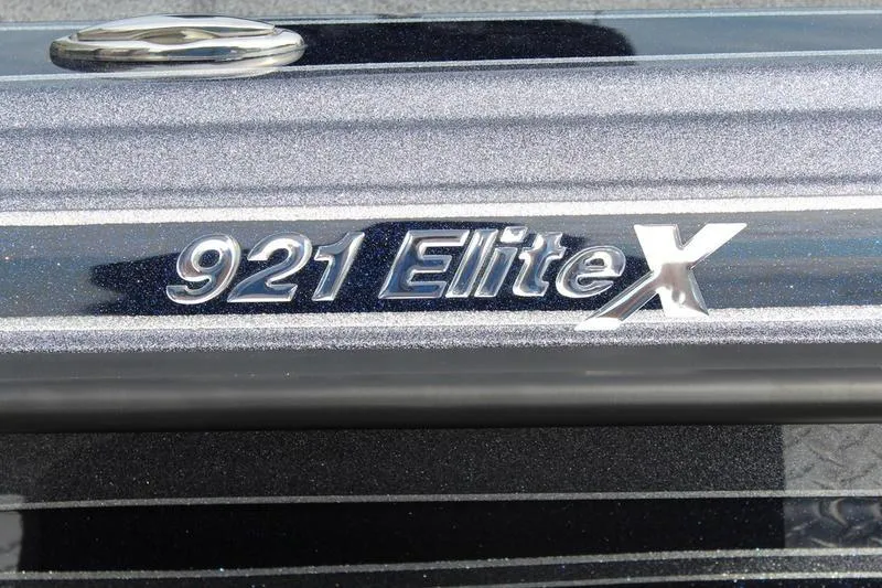 Slide: The Image of Close-up of 2027 Phoenix 921 Elite X model emblem on metallic surface. - 7