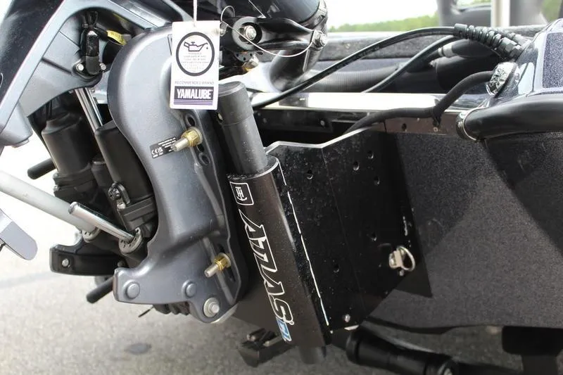 Slide: The Image of Close-up of a 2027 Phoenix 921 Elite X boat motor with Yamalube tag. - 3