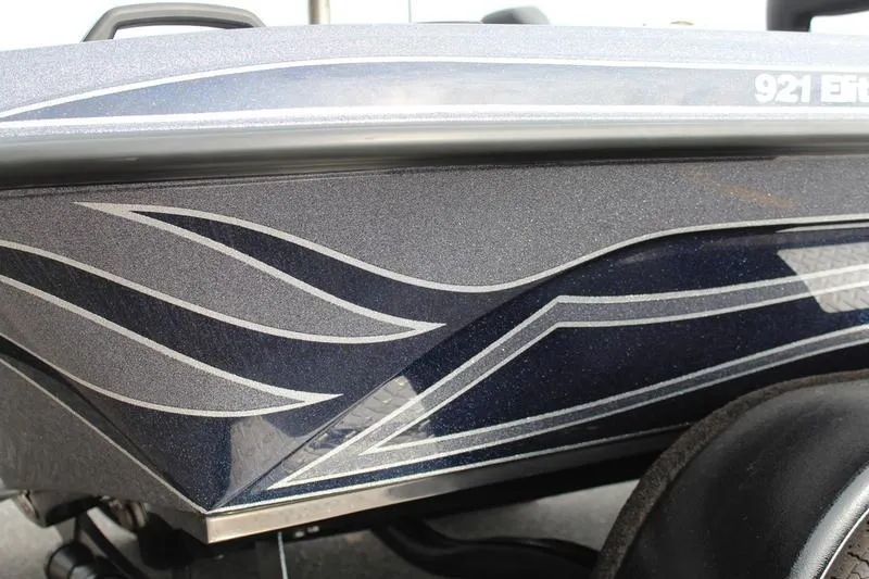 Slide: The Image of Close-up of 2027 Phoenix 921 Elite X boat with sleek, modern graphics. - 9