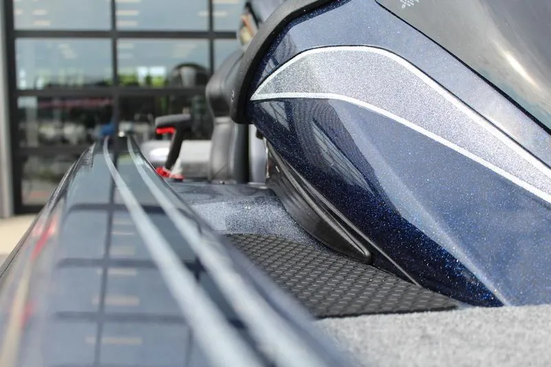 Slide: The Image of Close-up of a 2027 Phoenix 921 Elite X boat, showcasing sleek design and metallic finish. - 18