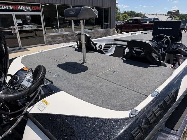 Slide: The Image of The image shows the deck of a 2024 Skeeter FXR21 Limited boat. - 5