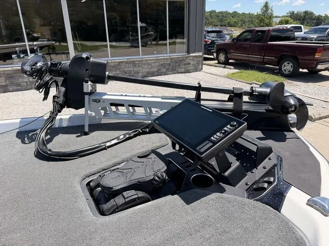 Slide: The Image of The image shows the deck of a 2024 Skeeter FXR21 Limited boat with a modern control system. - 11