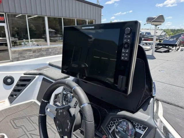 Slide: The Image of The image shows the cockpit of a 2024 Skeeter FXR21 Limited with a large screen. - 7