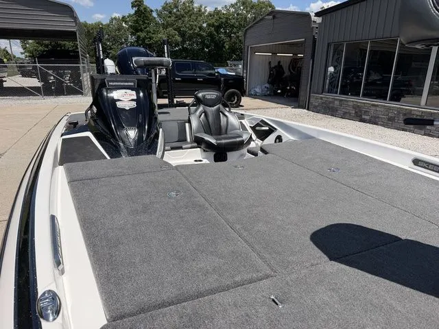 Slide: The Image of The image shows a 2024 Skeeter FXR21 Limited boat with a gray deck and black seat. - 10