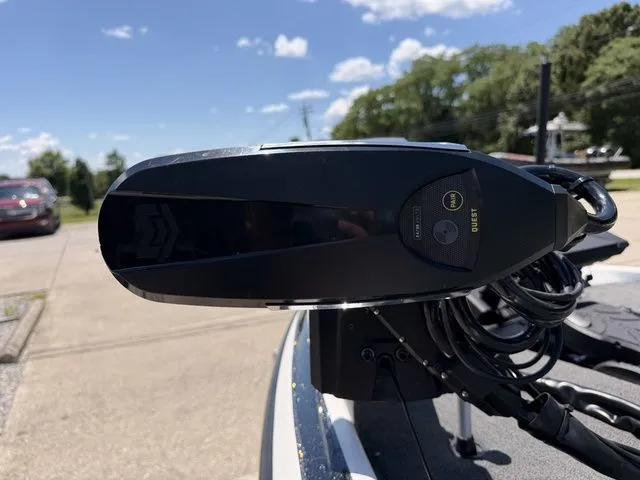 Slide: The Image of Close-up of a boat motor on a 2024 Skeeter FXR21 Limited, with cables and blue sky. - 12