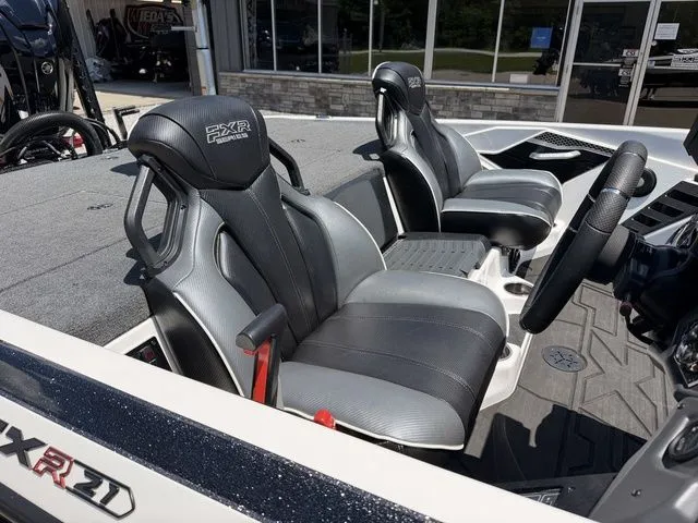 Slide: The Image of The image shows the interior of a 2024 Skeeter FXR21 Limited boat with two padded seats. - 8