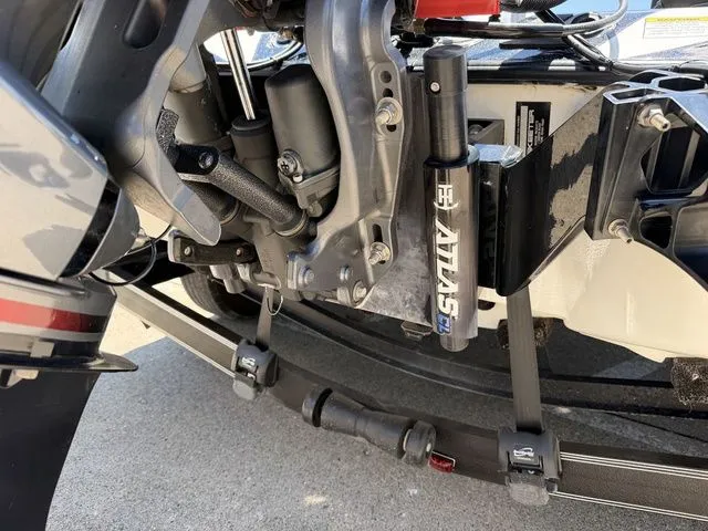 Slide: The Image of Close-up of a boat's engine and suspension, showing visible mechanical components. - 3