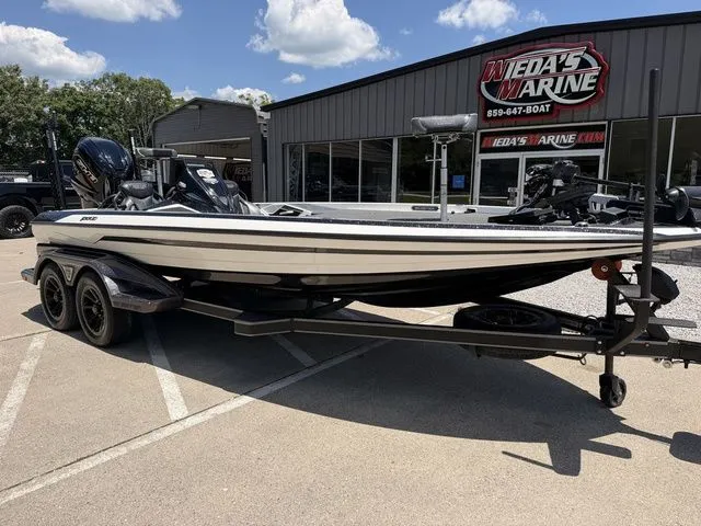 Slide: The Image of A 2024 Skeeter FXR21 Limited boat on a trailer in front of a building. - 9