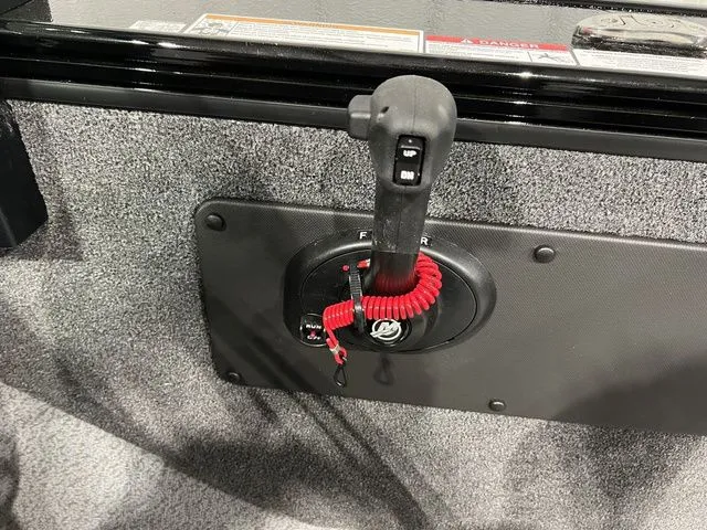 Slide: The Image of Close-up of a boat throttle lever with a red safety lanyard. - 25