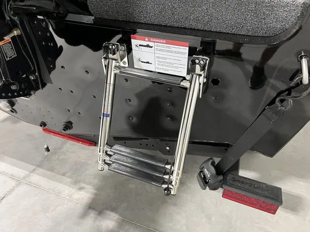 Slide: The Image of A foldable ladder is attached to the stern of a black boat. - 6