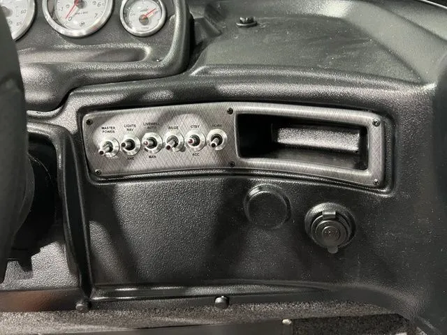 Slide: The Image of Boat dashboard with switches and gauges. - 20