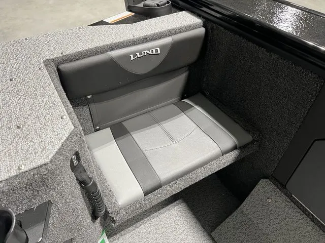 Slide: The Image of Gray padded seat in a boat with Lund logo. - 12
