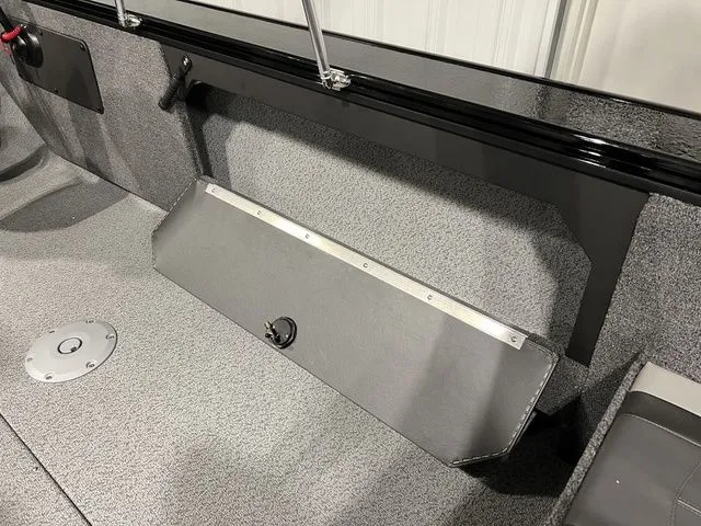 Slide: The Image of Interior view of a Lund 2075 Fisherman boat with gray carpeted flooring. - 18