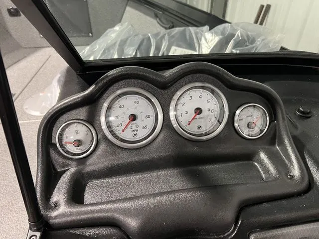 Slide: The Image of Dashboard of a Lund 2075 Fisherman boat with four round gauges. - 9