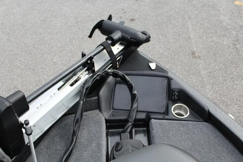 Slide: The Image of Front deck of a 2027 Phoenix 818 Pro boat with trolling motor and cup holder. - 17