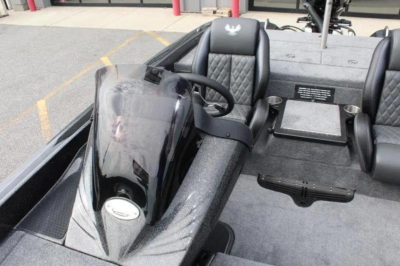Slide: The Image of Interior of 2027 Phoenix 818 Pro boat with steering console and seating. - 16