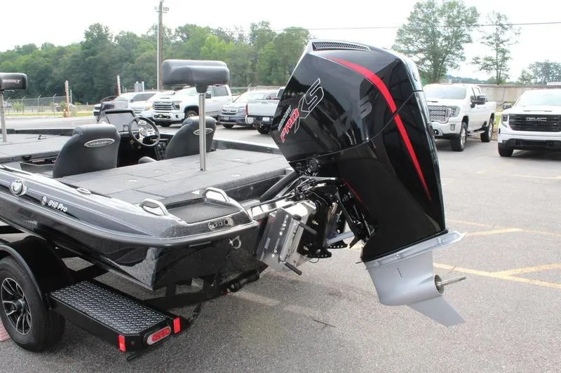 Slide: The Image of 2027 Phoenix 818 Pro boat with powerful outboard motor in parking lot. - 23