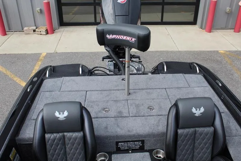 Slide: The Image of 2027 Phoenix 818 Pro boat interior with cushioned seats and branded headrest. - 15